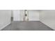 Bedroom with gray carpet, base trim and doors to other rooms of the home at 1645 Dahlia Dr, Cumming, GA 30040