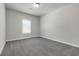 Bedroom featuring a window with blinds, recessed lighting, and gray carpet at 1645 Dahlia Dr, Cumming, GA 30040
