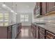 Gourmet kitchen featuring granite counters, stainless appliances, and ample cabinet space at 1645 Dahlia Dr, Cumming, GA 30040