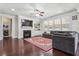 Spacious living room with a fireplace, built-in shelving, and large windows for ample natural light at 1645 Dahlia Dr, Cumming, GA 30040