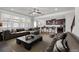 Open-concept living room with a view of the kitchen, featuring modern furnishings and lots of natural light at 1645 Dahlia Dr, Cumming, GA 30040