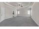 Spacious main bedroom featuring tray ceilings, recessed lighting, and large windows at 1645 Dahlia Dr, Cumming, GA 30040