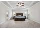 Spacious main bedroom with tray ceilings and soft carpet; a peaceful retreat at 1645 Dahlia Dr, Cumming, GA 30040