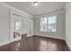 Versatile office space with hardwood floors, French doors, and a large window for ample light at 1645 Dahlia Dr, Cumming, GA 30040