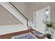 Inviting foyer with hardwood floors, staircase, and ample natural light at 200 Boca Ciega Ct, Alpharetta, GA 30022
