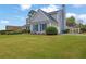 Beautiful home with manicured lawn, mature landscaping, and blue shutters at 200 Boca Ciega Ct, Alpharetta, GA 30022