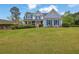 Charming two-story home with blue shutters and a lush green lawn at 200 Boca Ciega Ct, Alpharetta, GA 30022