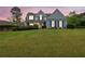 Charming two-story home with blue shutters and a lush green lawn during twilight at 200 Boca Ciega Ct, Alpharetta, GA 30022
