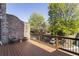 Balcony featuring a wooden floor, brick wall and seating for two at 25 High Gate Trail, Atlanta, GA 30030