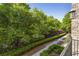 Scenic view from the balcony overlooking lush greenery and manicured landscape at 25 High Gate Trail, Atlanta, GA 30030