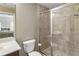 Modern bathroom featuring a tiled glass enclosed shower and a sleek vanity with a white countertop at 25 High Gate Trail, Atlanta, GA 30030
