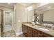 A well-appointed bathroom features double sinks, granite countertops, and a large mirror at 25 High Gate Trail, Atlanta, GA 30030