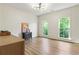 Bright bedroom with hardwood floors, large windows, and stylish lighting fixture at 25 High Gate Trail, Atlanta, GA 30030