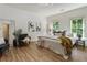 Bright bedroom features light wood floors, modern lighting, and large windows providing natural light and wooded views at 25 High Gate Trail, Atlanta, GA 30030