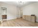 Open bedroom featuring hardwood floors, modern storage, closet and bathroom access at 25 High Gate Trail, Atlanta, GA 30030