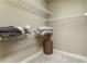 Bright walk-in closet with built-in shelving, carpeted floor, and ample storage space at 25 High Gate Trail, Atlanta, GA 30030
