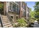 Brick townhomes featuring multiple stories and small front yards at 25 High Gate Trail, Atlanta, GA 30030