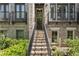 Brick townhome with decorative features and a front door at the top of the stairs at 25 High Gate Trail, Atlanta, GA 30030
