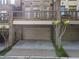 Brick townhome featuring a two-car garage and outdoor deck at 25 High Gate Trail, Atlanta, GA 30030