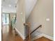 Hallway featuring hardwood floors, a staircase, and natural light streaming from the entrance at 25 High Gate Trail, Atlanta, GA 30030