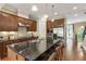 Spacious kitchen with a large island, stainless steel appliances, and adjacent living area at 25 High Gate Trail, Atlanta, GA 30030