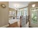 Landing with hardwood floors, adjacent sitting area and lots of natural light at 25 High Gate Trail, Atlanta, GA 30030