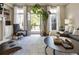 Spacious living room featuring floor to ceiling windows, stylish furniture, and lots of natural light at 25 High Gate Trail, Atlanta, GA 30030