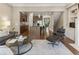 Open-concept living room with hardwood floors, modern furniture, and seamless flow to kitchen at 25 High Gate Trail, Atlanta, GA 30030