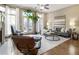 Bright living room featuring hardwood floors, a ceiling fan, and a cozy seating arrangement at 25 High Gate Trail, Atlanta, GA 30030
