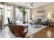 Bright living room with large windows, stylish furniture, and access to outdoor balcony at 25 High Gate Trail, Atlanta, GA 30030