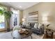 Comfortable living room with a large sectional sofa, stylish decor, and ample natural light at 25 High Gate Trail, Atlanta, GA 30030