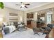 Open-concept living room featuring dark wood floors, modern lighting, and views of the kitchen at 25 High Gate Trail, Atlanta, GA 30030