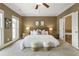 Bedroom with a king-sized bed, neutral decor, and an ensuite bathroom at 25 High Gate Trail, Atlanta, GA 30030