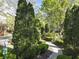 A serene community walking path with lush landscaping, leading to various outdoor amenities at 25 High Gate Trail, Atlanta, GA 30030