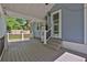 Covered back porch with a ceiling fan and stairs leading to the backyard at 3090 Thrasher Nw Ct, Kennesaw, GA 30144