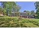 A large backyard features a covered porch, and patio area at 3090 Thrasher Nw Ct, Kennesaw, GA 30144