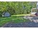 The expansive backyard features a shed, patio area, and plenty of green space at 3090 Thrasher Nw Ct, Kennesaw, GA 30144