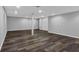 Newly finished basement featuring laminate flooring and recessed lighting at 3090 Thrasher Nw Ct, Kennesaw, GA 30144