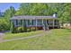 Charming single-story home featuring a welcoming front porch and well-manicured lawn at 3090 Thrasher Nw Ct, Kennesaw, GA 30144