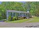 Well-maintained home with a lush front lawn, mature trees, and a private driveway at 3090 Thrasher Nw Ct, Kennesaw, GA 30144