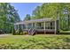 Inviting home with a charming front porch, manicured landscaping, and a serene setting at 3090 Thrasher Nw Ct, Kennesaw, GA 30144