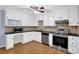Bright kitchen featuring white cabinets, stainless steel appliances, and granite countertops at 3090 Thrasher Nw Ct, Kennesaw, GA 30144