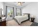Comfortable bedroom with natural light, a ceiling fan, and a cozy bed, perfect for relaxation at 460 Marston Pass, Acworth, GA 30102