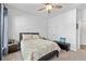 Inviting bedroom with a ceiling fan, a cozy bed, and a calming atmosphere, ideal for rest at 460 Marston Pass, Acworth, GA 30102