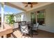 Outdoor view of a wooden deck, ceiling fan, outdoor seating, table, potted tree and home at 460 Marston Pass, Acworth, GA 30102