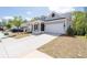 Beautiful single-Gathering home with a spacious driveway, attached two-car garage, and inviting front porch at 460 Marston Pass, Acworth, GA 30102