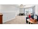Spacious upstairs living room area with furniture and ceiling fan with great natural light at 460 Marston Pass, Acworth, GA 30102