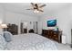 Spacious main bedroom featuring a ceiling fan, warm carpet, and en suite bathroom at 460 Marston Pass, Acworth, GA 30102