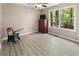 Serene bedroom featuring a large window with nature views and warm, neutral tones at 191 Orchard Dr, Canton, GA 30115