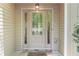 Welcoming front door with decorative glass, sidelights, and a stone-accented threshold offering a warm and inviting entry at 191 Orchard Dr, Canton, GA 30115
